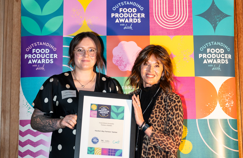 Hawke's Bay farmers market winners holding their award at the outstanding food producer awards
