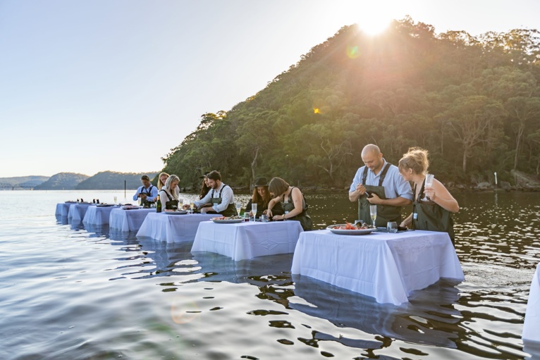People shucking fresh oysters at Hawkesbury River