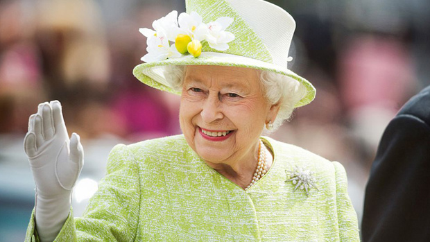 The Queen uses back up hand for royal wave