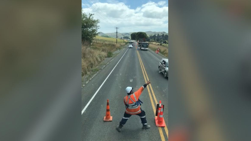 Road worker delights with dancing 