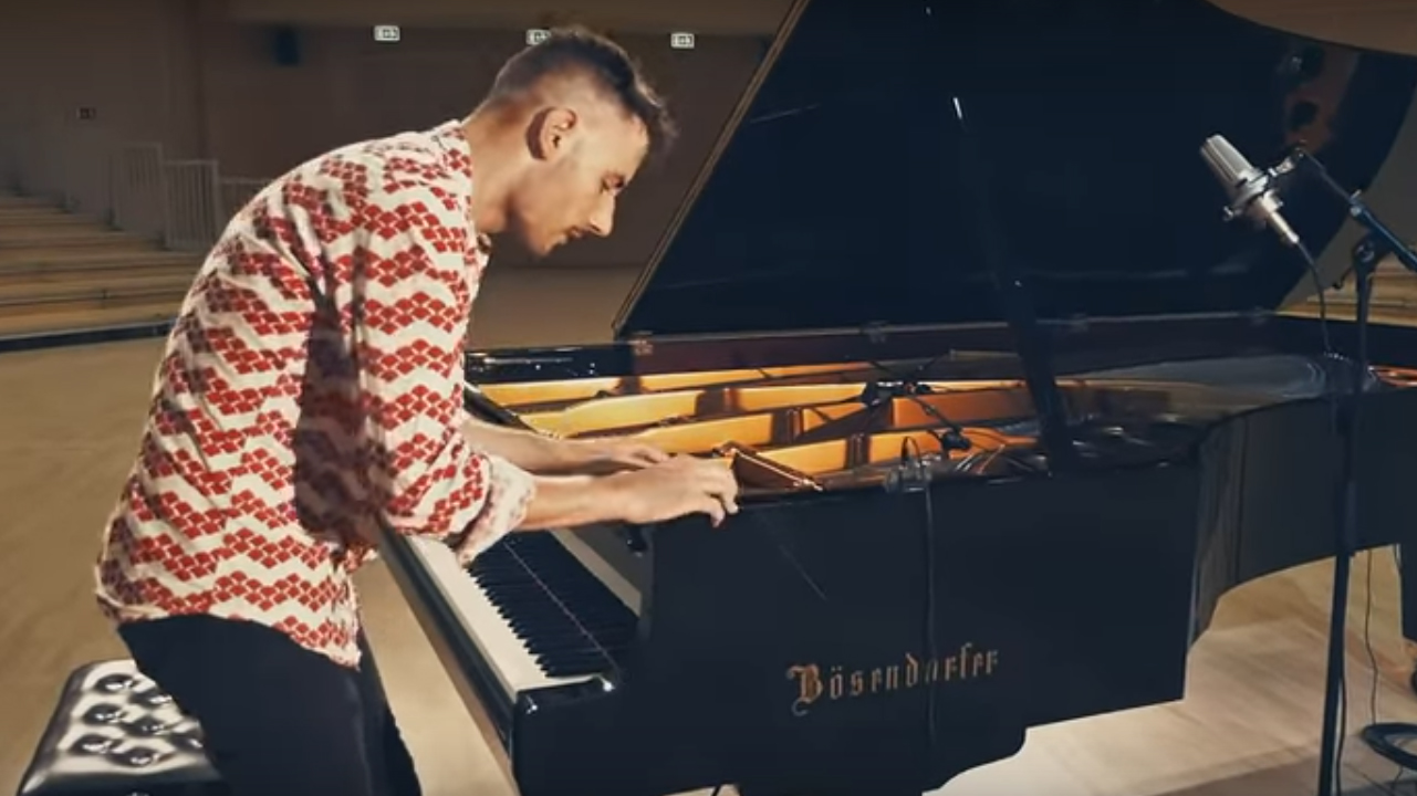 Man performs incredible cover of Toto's 'Africa' using every part of a grand piano