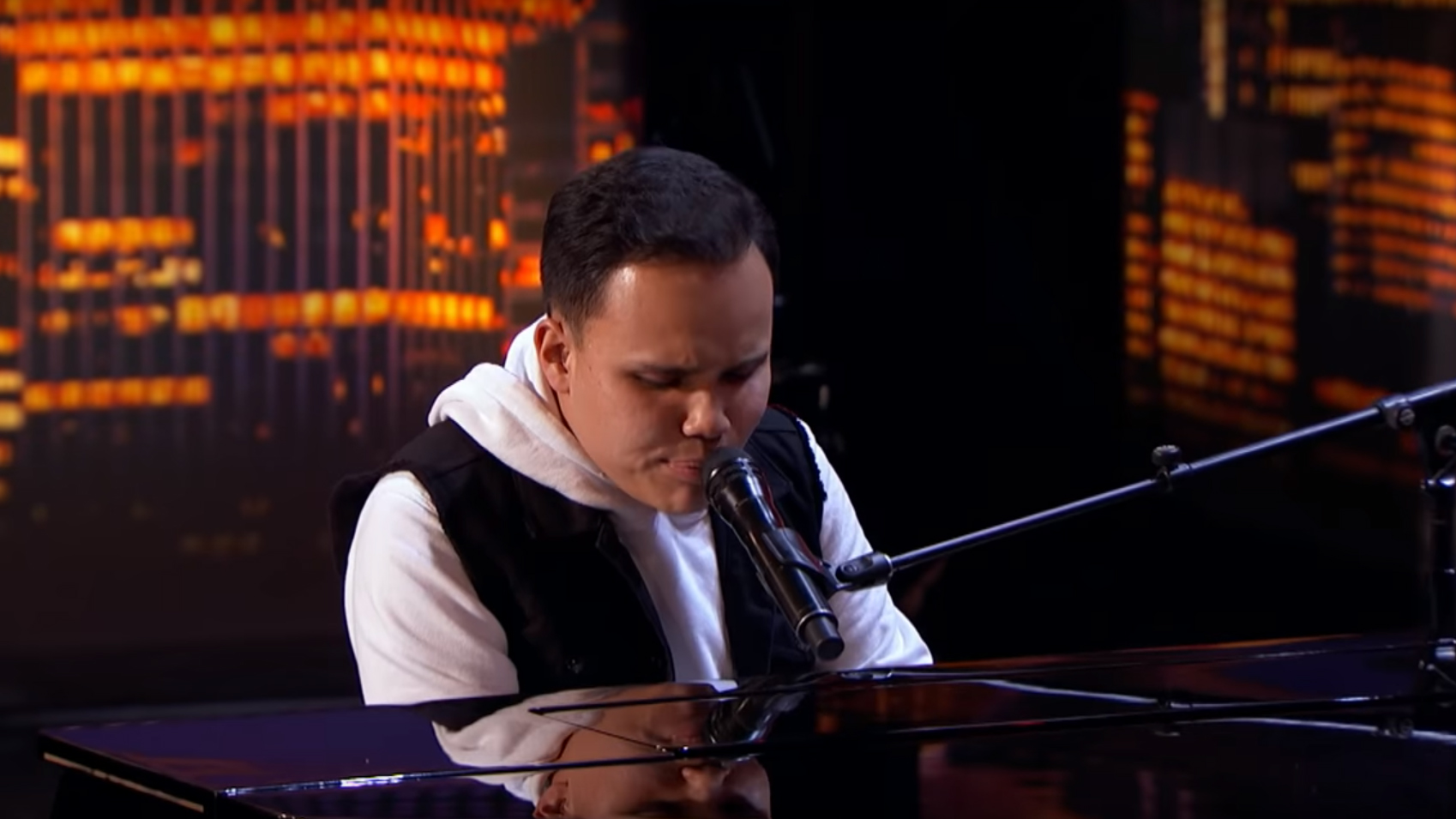 Blind autistic singer leaves America's Got Talent judges in tears with spine-tingling piano performance