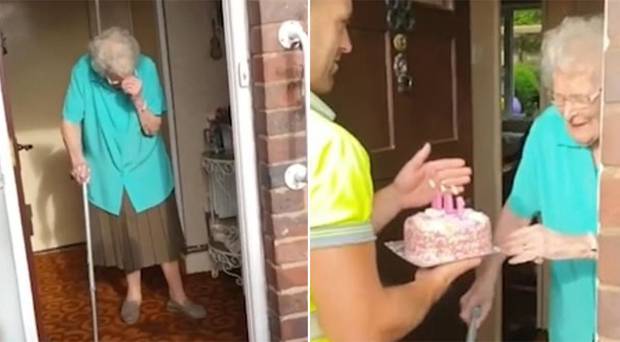 Rubbish truck workers surprise their favourite customer with a cake for her 100th birthday