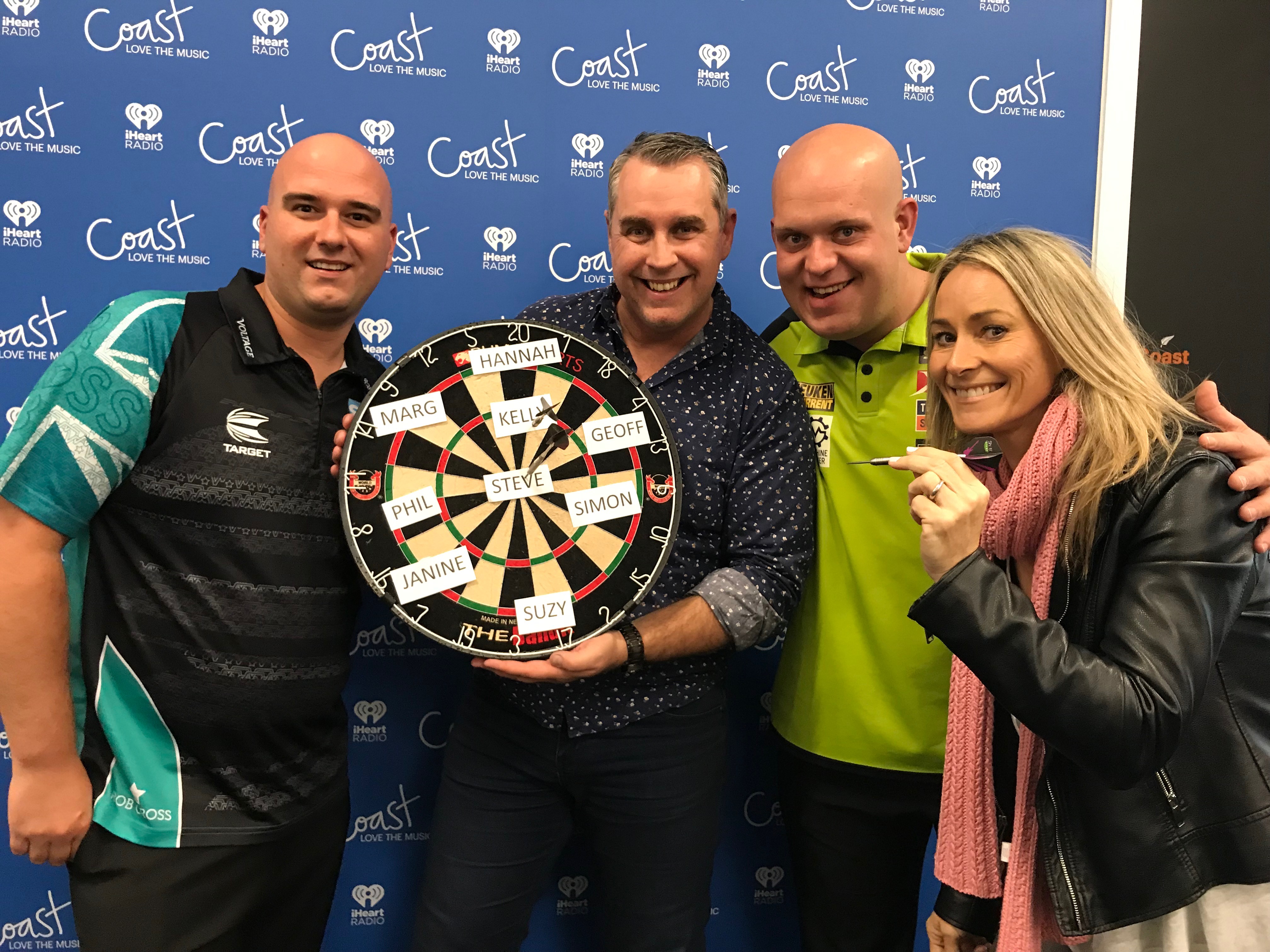 Jase freaks out as Darts Masters Michael Van Gerwen and Rob Cross throw darts at his face