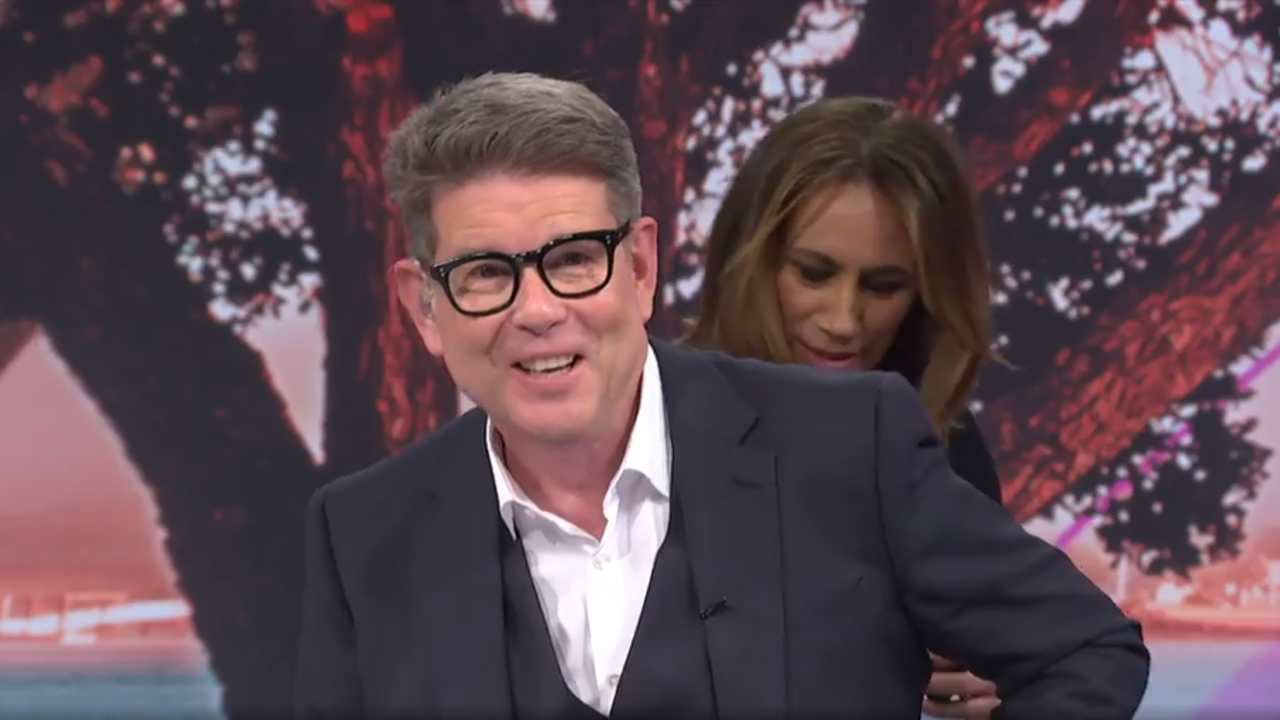 Jenny-May Clarkson helps John Campbell as he suffers an on-air malfunction
