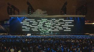 The names of the 51 people killed in the Christchurch mosque shootings were reflected on the screen while the Irish band played 'One' / NZ Herald / Stewart Sowman-Lund