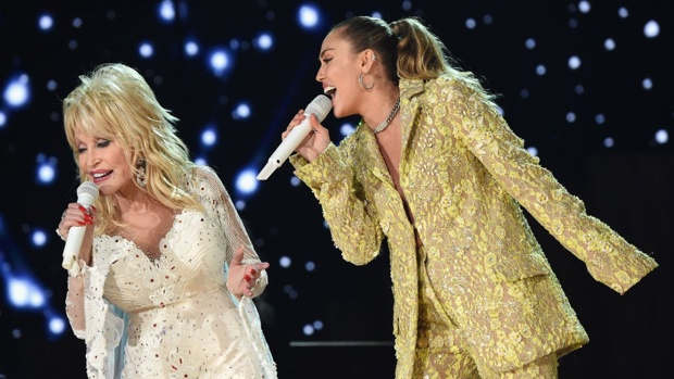 Dolly and Miley performing at the Grammy awards in 2019 / Getty Images