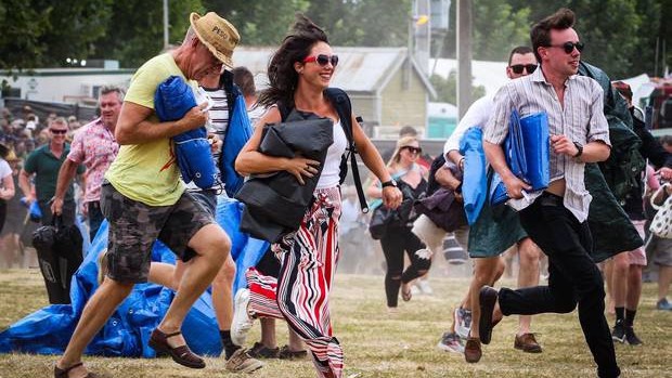 Women and children fend for yourselves ... people make the mad dash into Mission Estate. Photo / Paul Taylor
