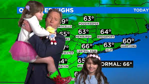 Weather reporter gets hilariously interrupted by his two adorable daughters during live broadcast