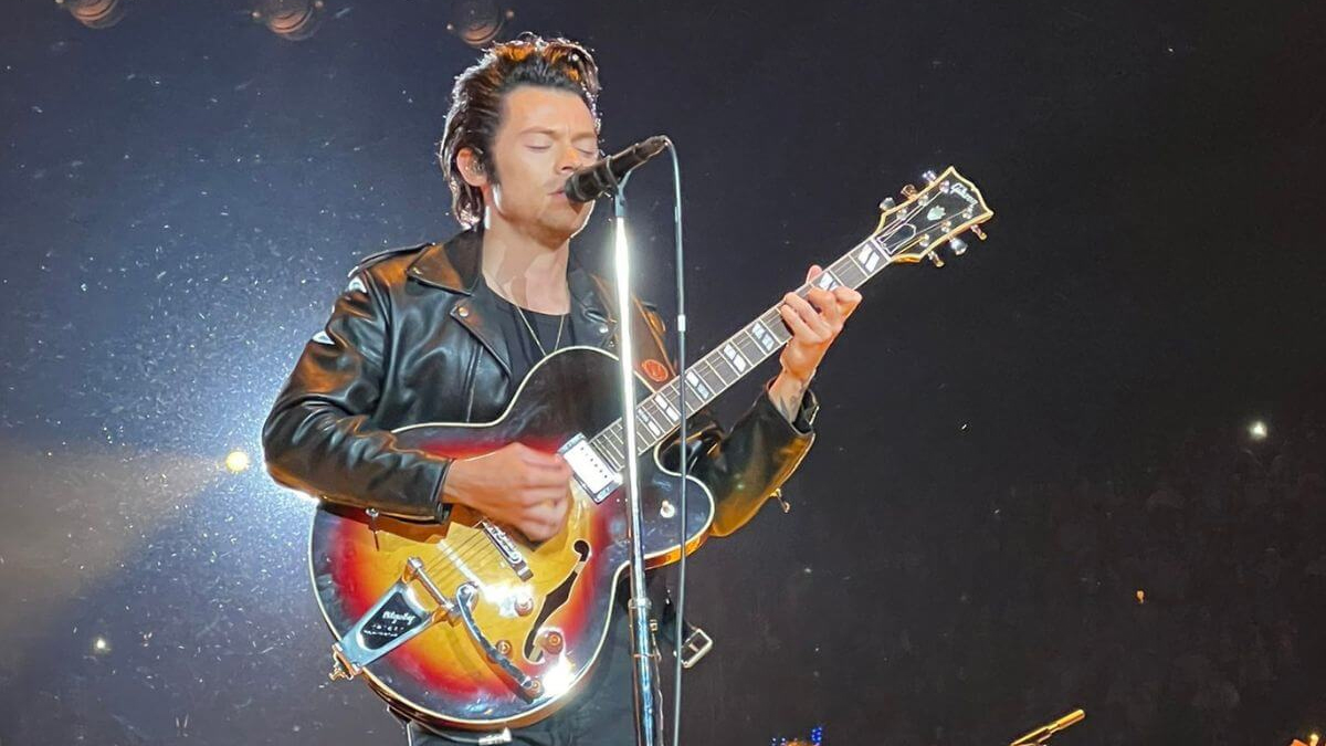 Harry Styles wows with 'Hopelessly Devoted to You' cover while dressed as Danny Zuko at Halloween concert
