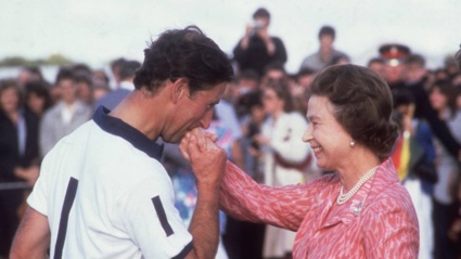 Charles kisses the hand of his mother, Queen Elizabeth II, at a polo match in 1985. Photo / Getty Images
