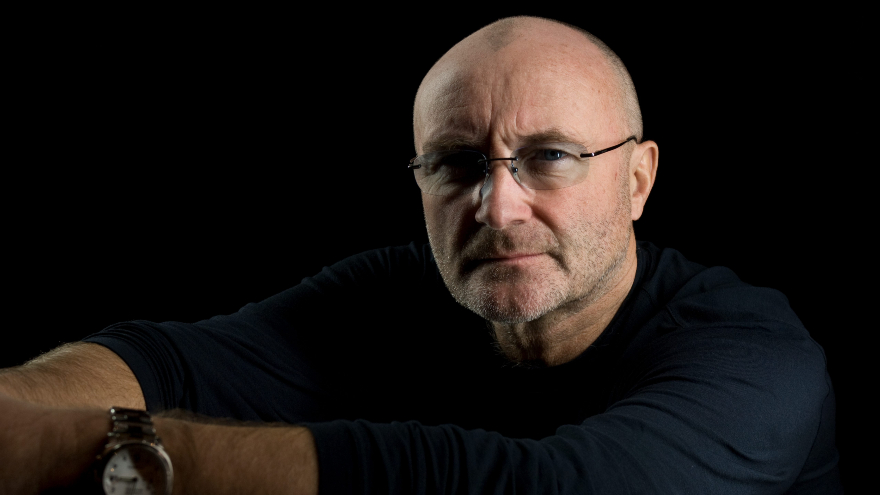 Phil Collins makes rare appearance at Buckingham Palace