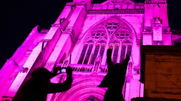 Dunedin’s St Paul’s Cathedral was lit up to celebrate the arrival of American pop singer Pink in the city. Pink will perform at Forsyth Barr Stadium. Photo / Stephen Jaquiery