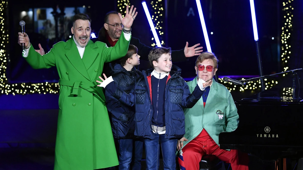 Elton John performs stunning rendition of 'Your Song' with his sons at Saks Fifth Avenue’s Window Unveiling