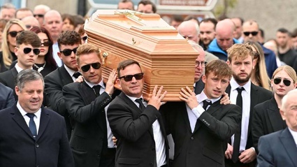 Ronan Keating (centre middle left) helps carry the coffin of his brother Ciaran Keating towards St Patrick's Church in Louisburgh, Co Mayo, for his funeral. Photo / Getty Images via NZ Herald