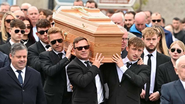 Ronan Keating (centre middle left) helps carry the coffin of his brother Ciaran Keating towards St Patrick's Church in Louisburgh, Co Mayo, for his funeral. Photo / Getty Images via NZ Herald