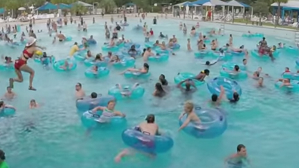 Can You Spot The Drowning Child In This Photo? Luckily The Lifeguard Did