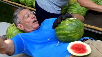 Man sets record for slicing the most watermelons on his stomach