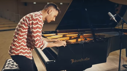 Watch this incredible cover of Toto's 'Africa' using every part of a grand piano