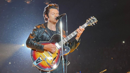 Harry Styles wows with 'Hopelessly Devoted to You' cover while dressed as Danny Zuko at Halloween concert