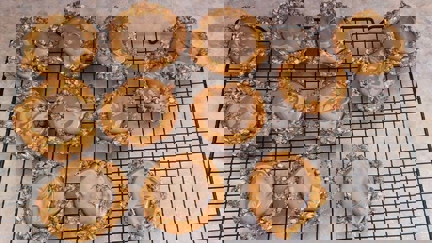 Mini Anzac biscuit caramel tarts with chocolate drizzle
