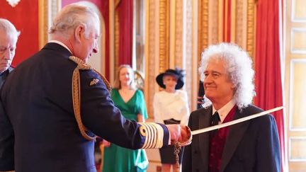 Queen’s Brian May becomes Sir Brian Harold May as he is officially knighted at Buckingham Palace