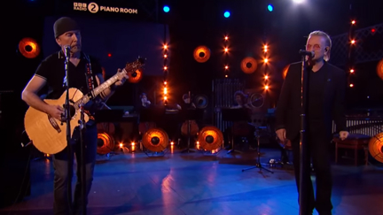 U2's Bono and The Edge perform hauntingly beautiful orchestral cover of ABBA's 'S.O.S'